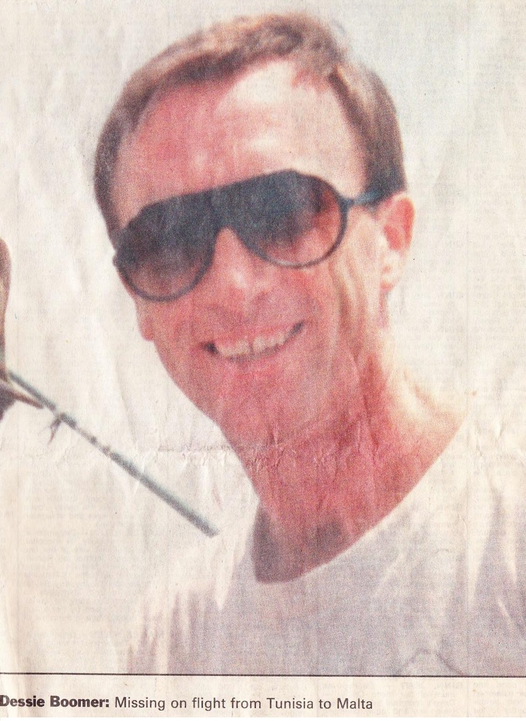 Dessie Boomer Head and shoulders shot of Desmond Boomer wearing sunglasses and a white t-shirt